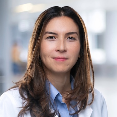 Dr. Haran in her white coat