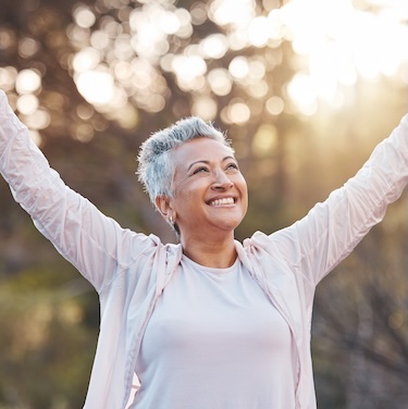 Cancer survivor thriving and celebrating being healthy